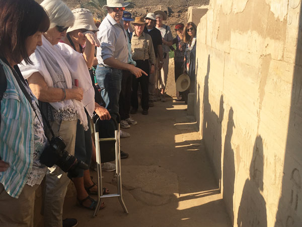Bill Manley translates an inscription at El Tod with our BSS group